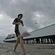 A woman fills sandbags along Daytona Beach, Fl in advance of Hurricane Matthew’s arrival. Image: AP